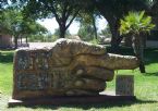 An outdoor sculpture of a hand, located outside the Art Center